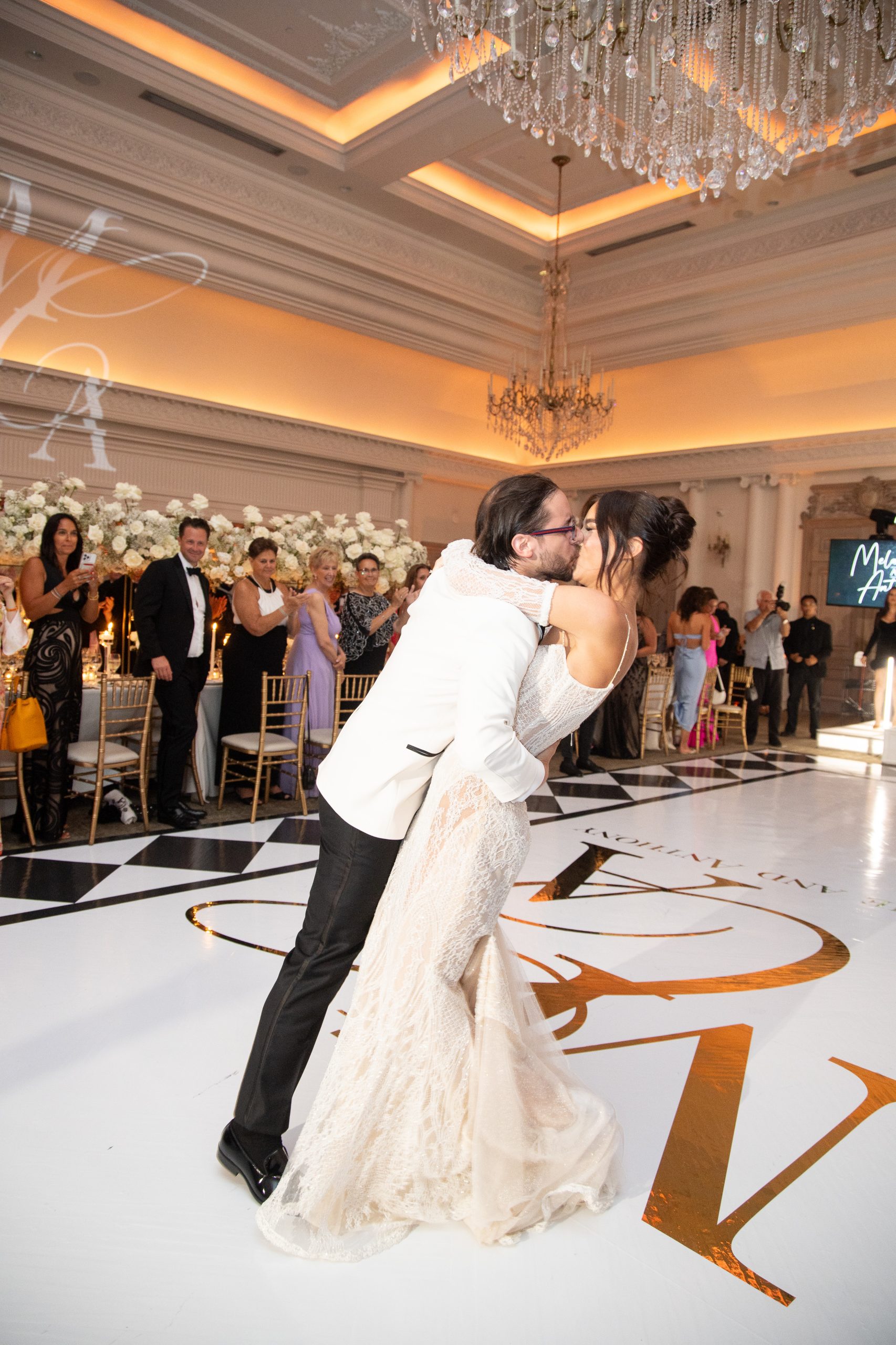 bride and groom kissing on the dance floor