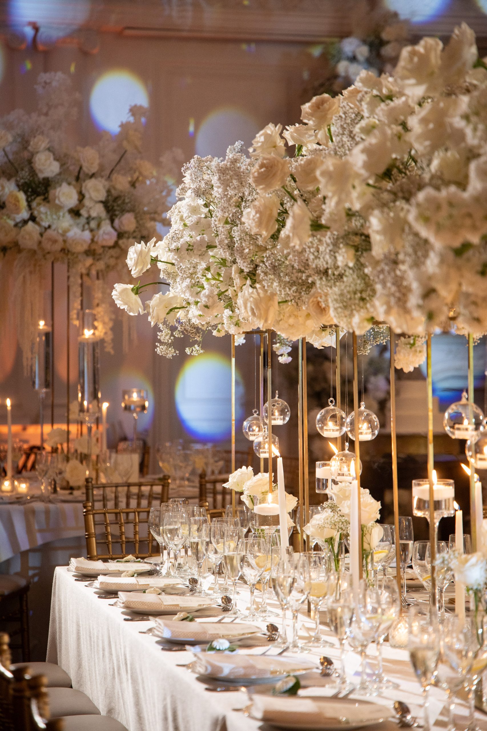 tall white centerpieces at a wedding