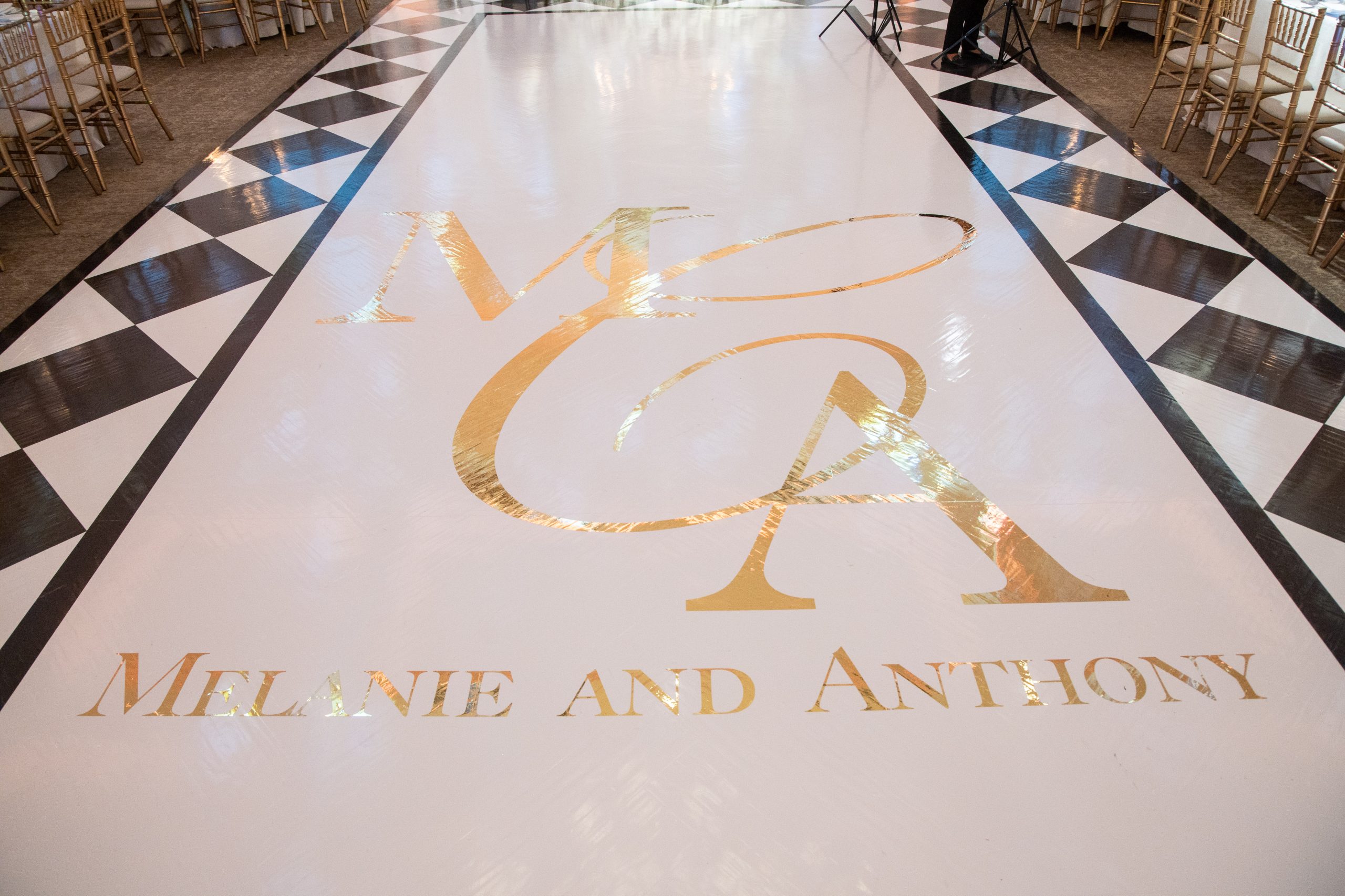 dance floor with gold letters and black and white trim