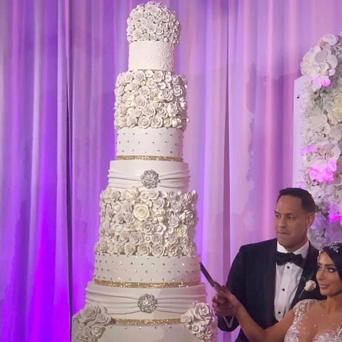 bride and groom cutting cake