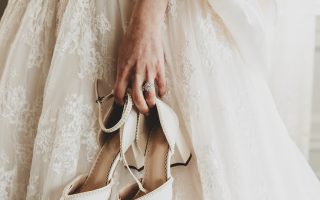 bride holding shoes