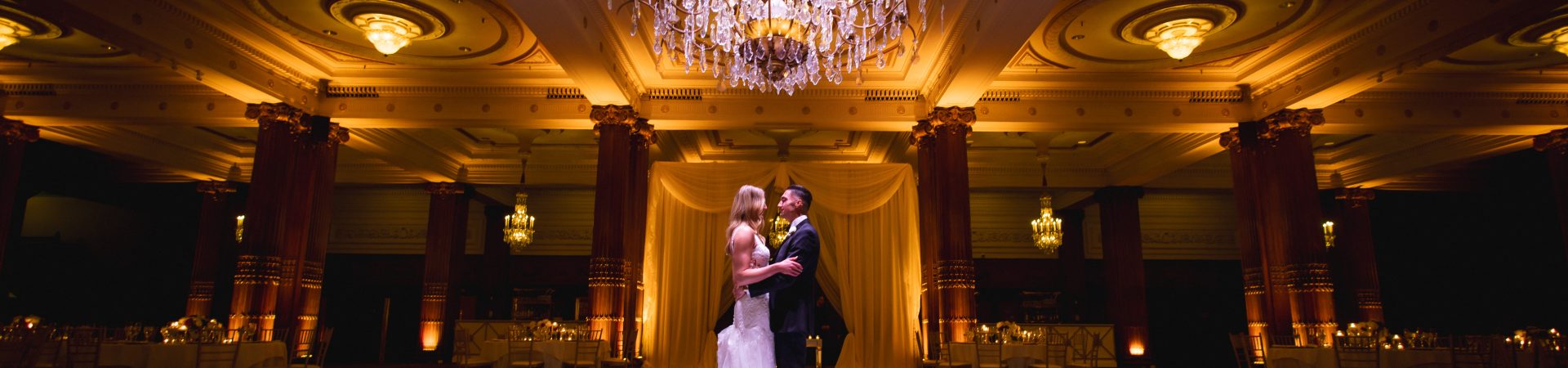 bride and groom alone in ballroom