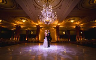 bride and groom alone in ballroom