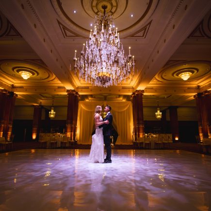 bride and groom alone in ballroom