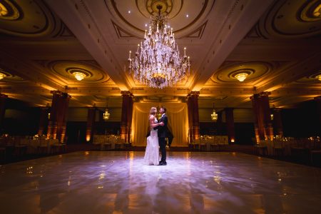 bride and groom alone in ballroom