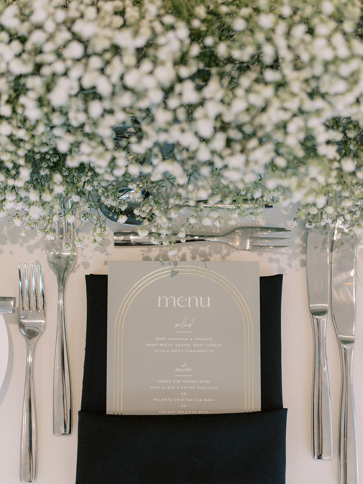 babys breath and menu card at wedding