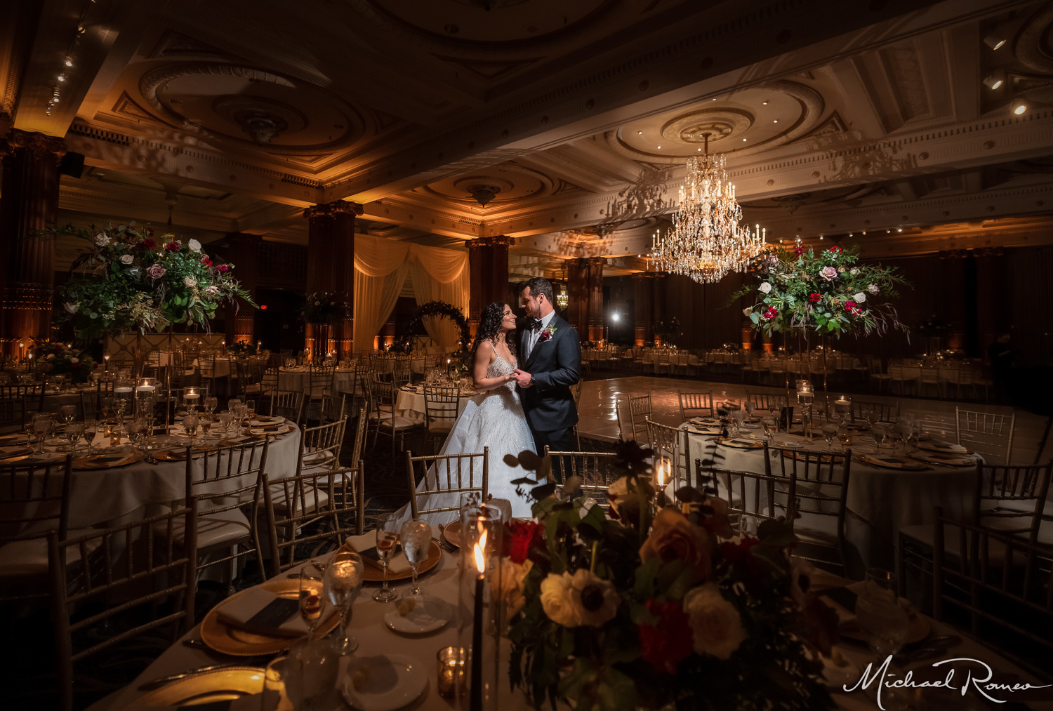 bride and groom in dark ballroom