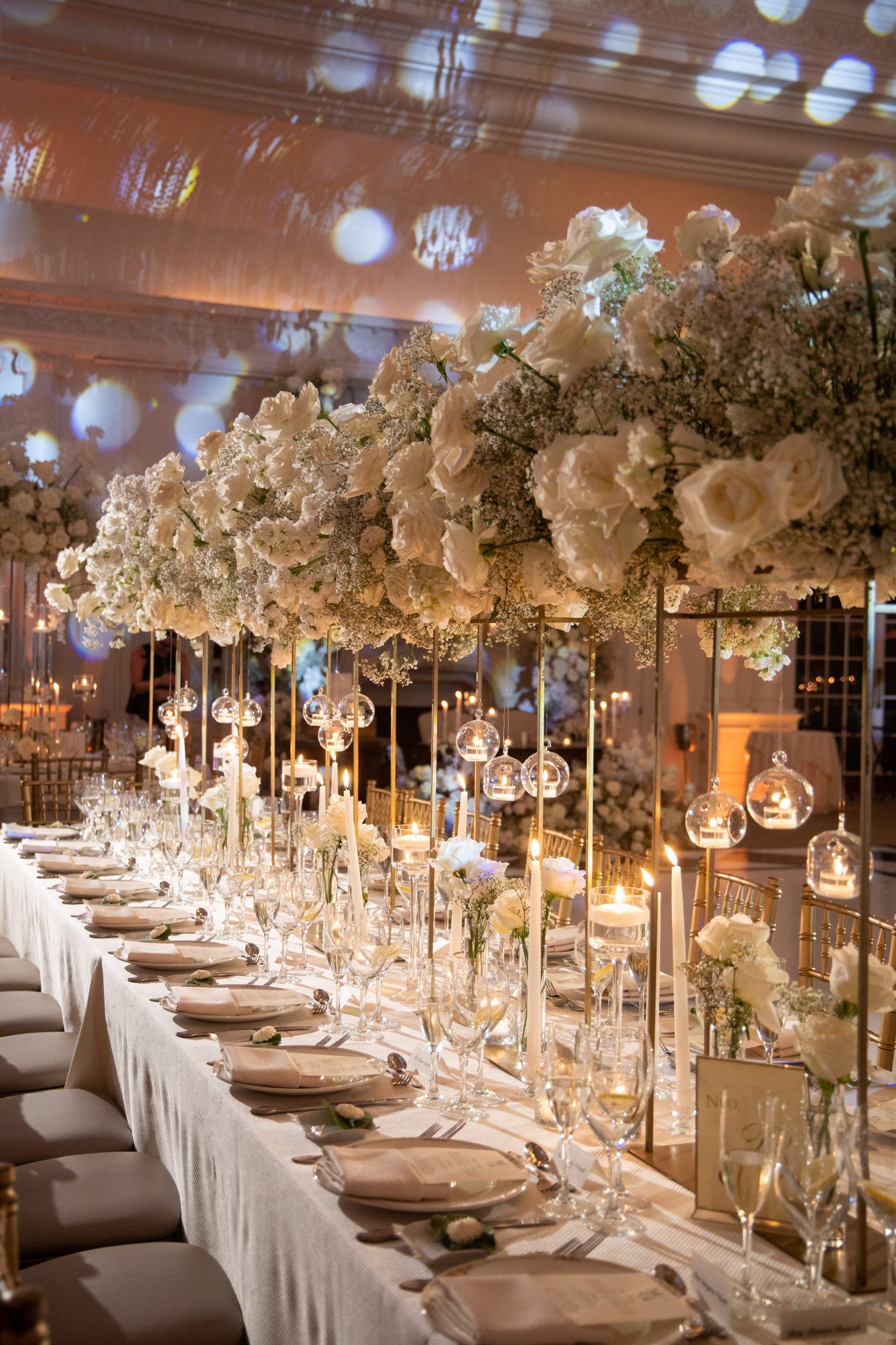 tall all white centerpieces at a wedding