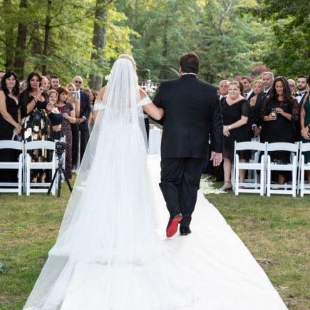 bride walking down the aisle with her dad