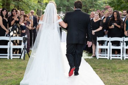 bride walking down the aisle with her dad
