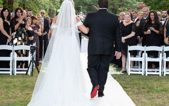 bride walking down the aisle with her dad