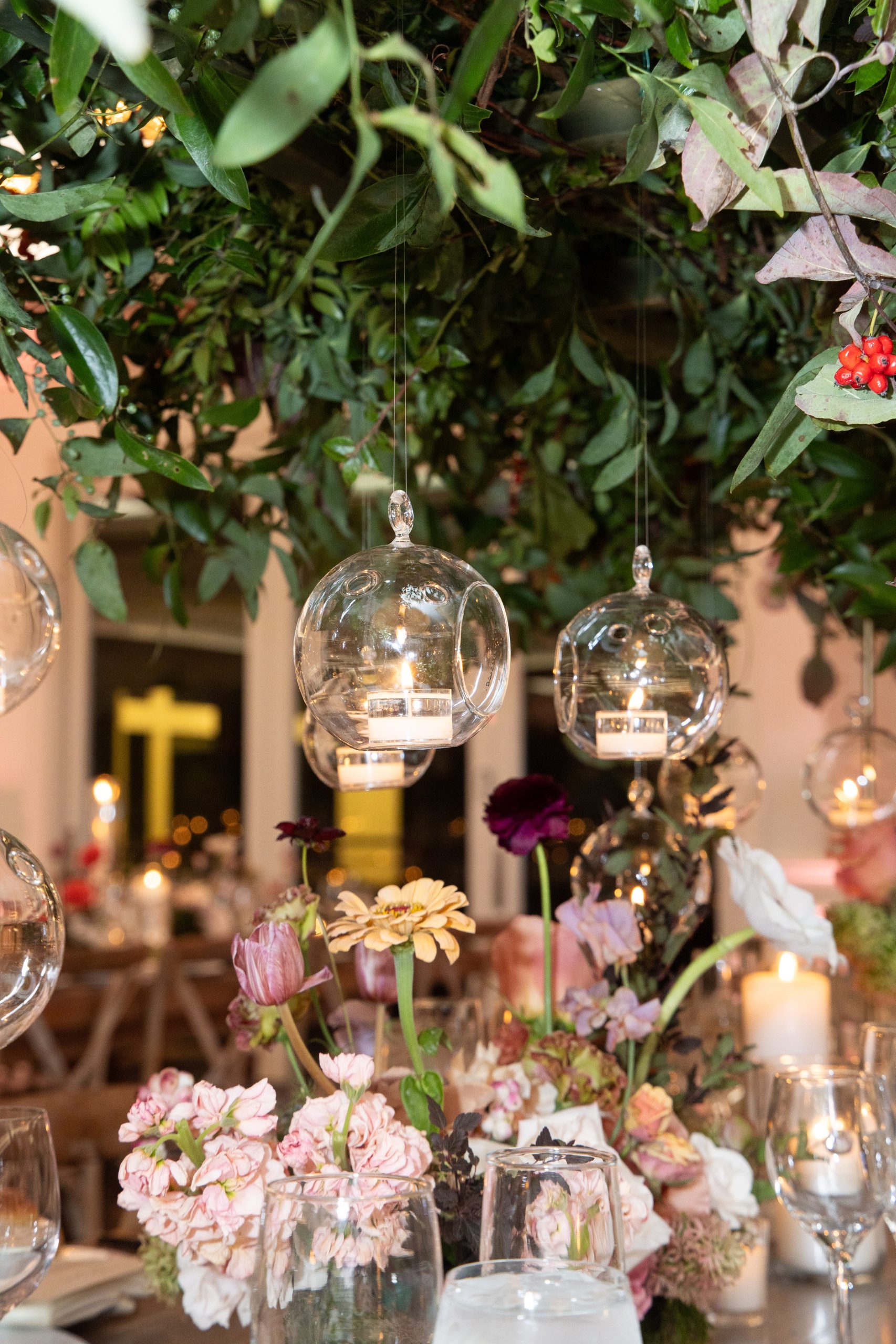 hanging candles with greenery