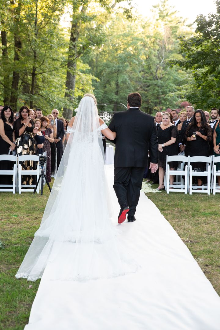 bride walking down the aisle with her dad