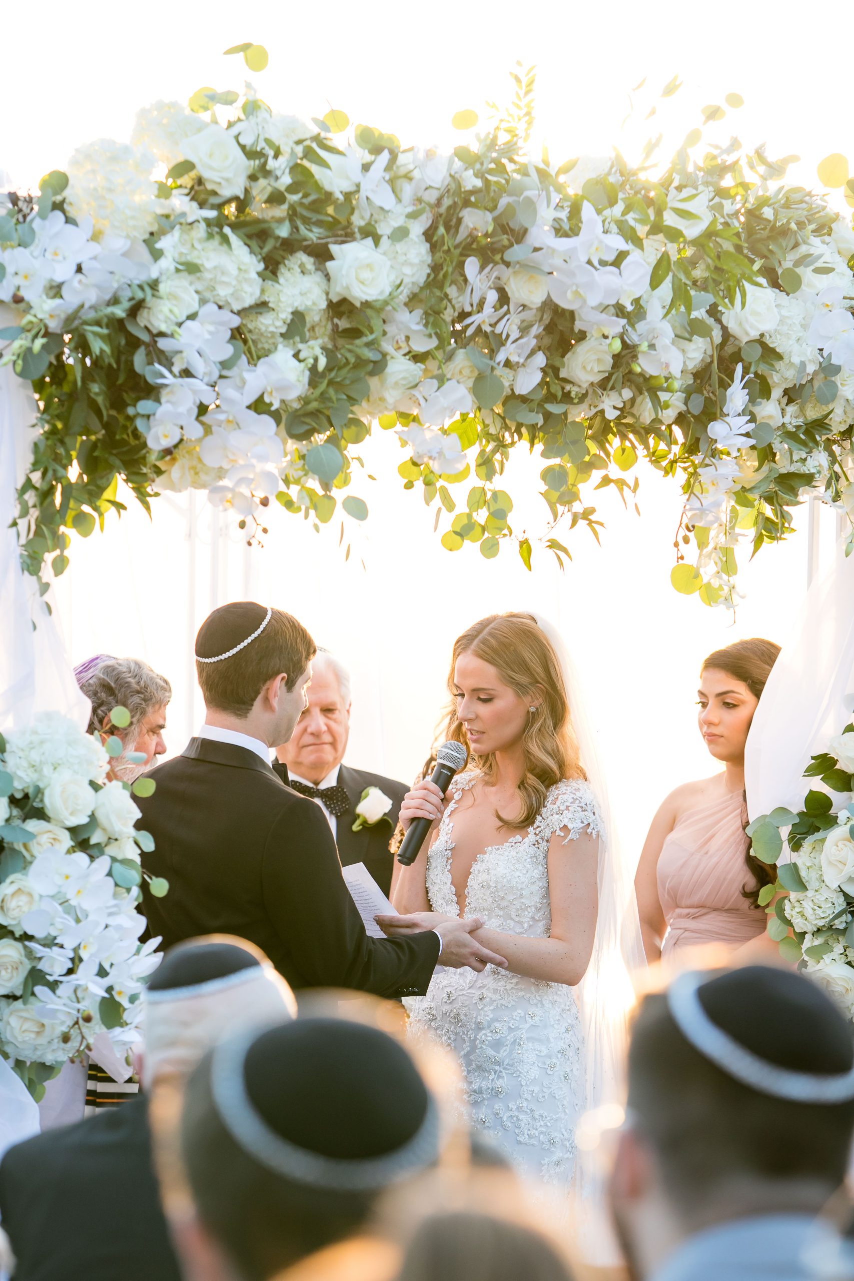 bride and groom under chuppah