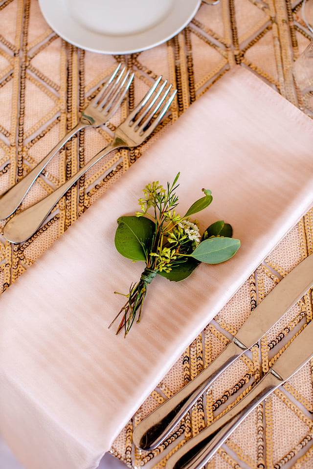 napkin at wedding with greenery on top