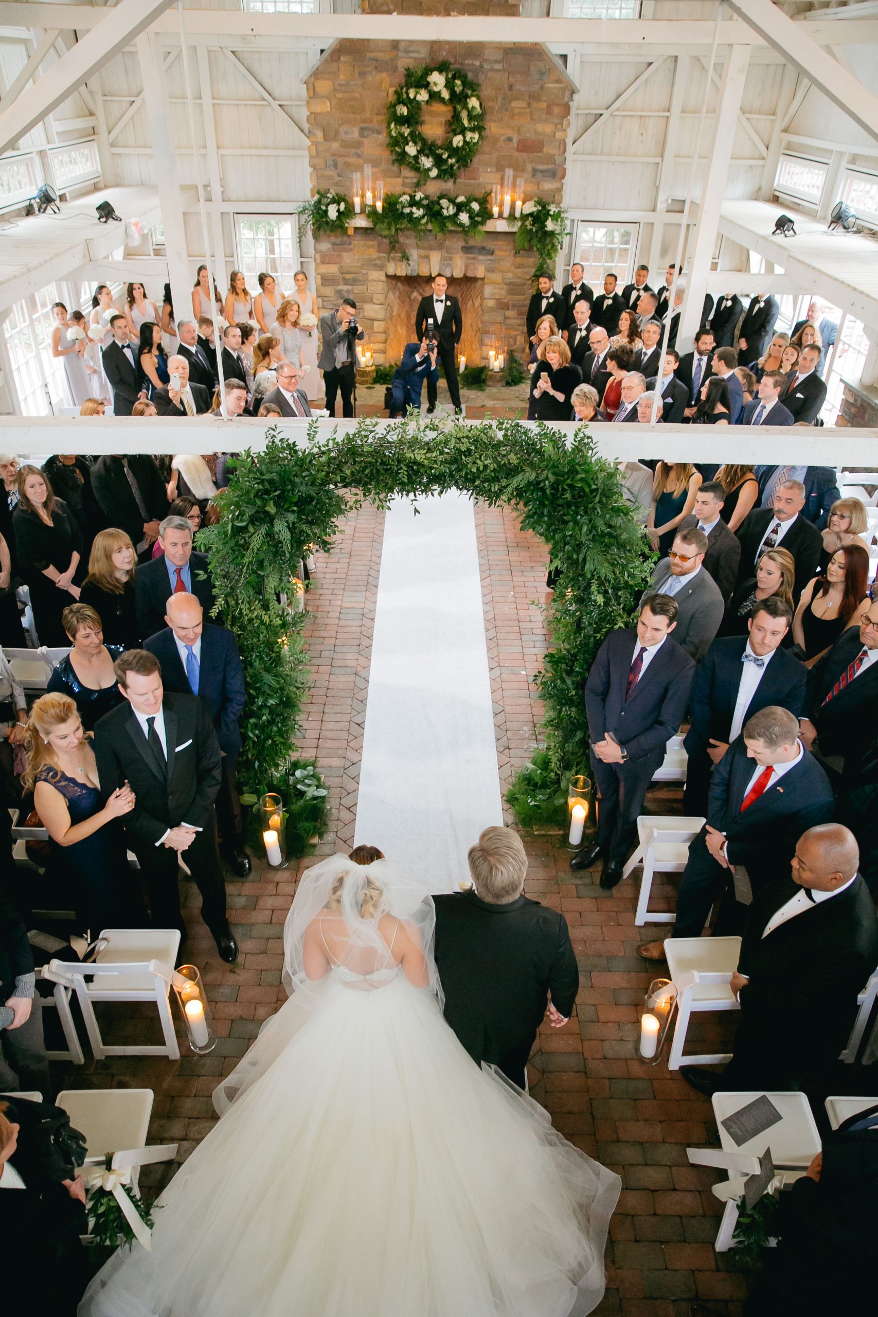 father of the bride and bride walking down the aisle