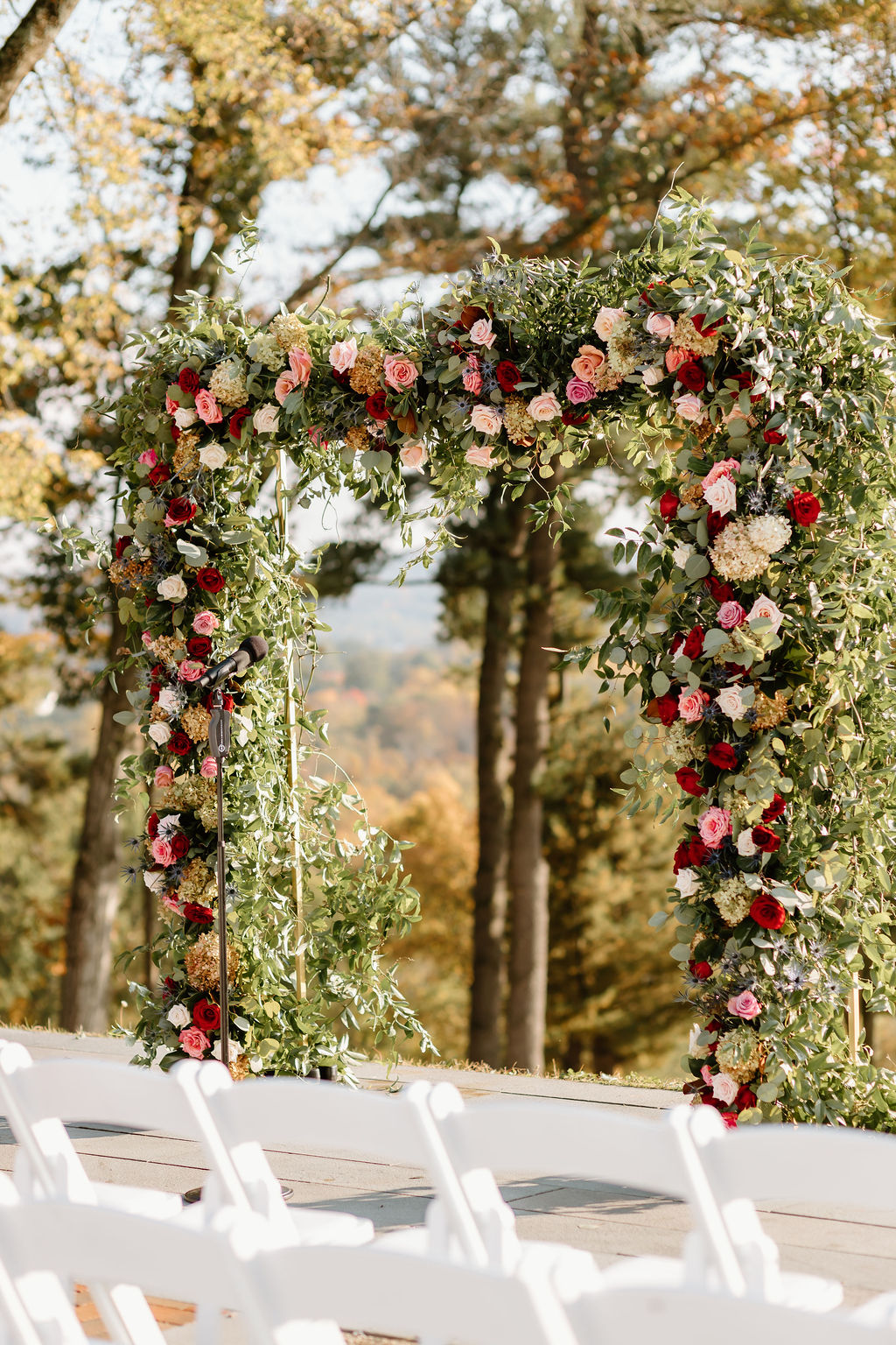 green and floral wedding arbor