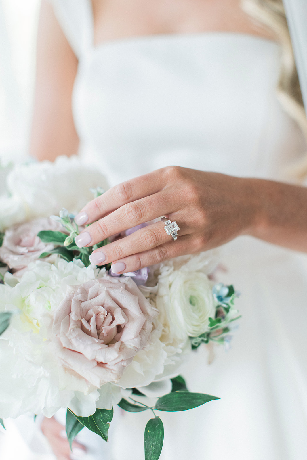 bride playing with bouquet