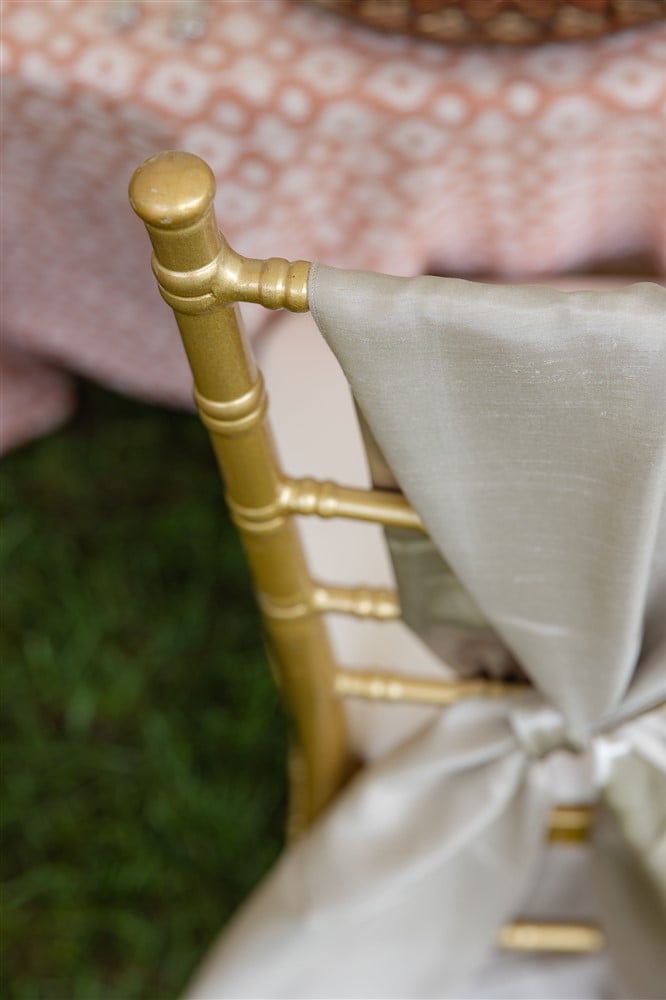 chair sash on top of gold chiavari chair