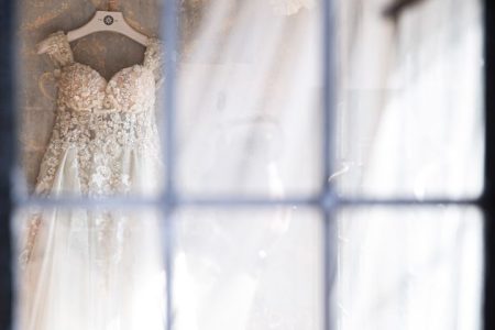 white wedding gown on hanger