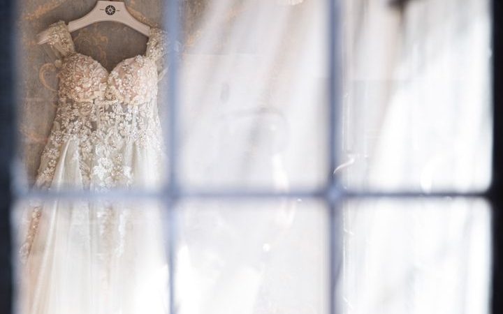 white wedding gown on hanger