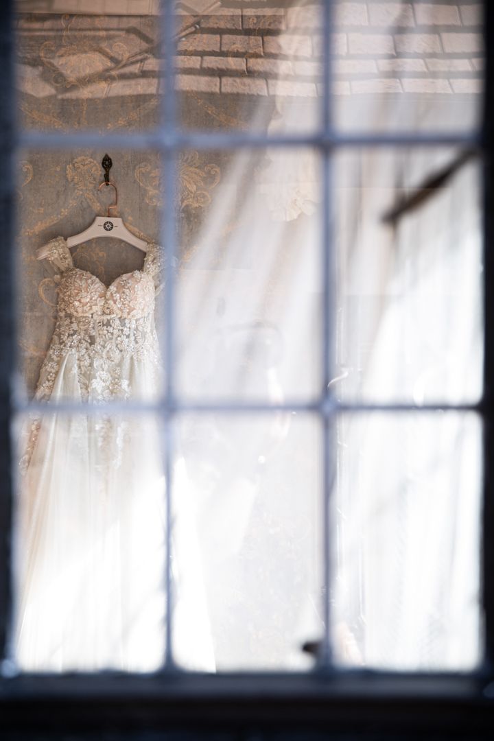 white wedding gown on hanger
