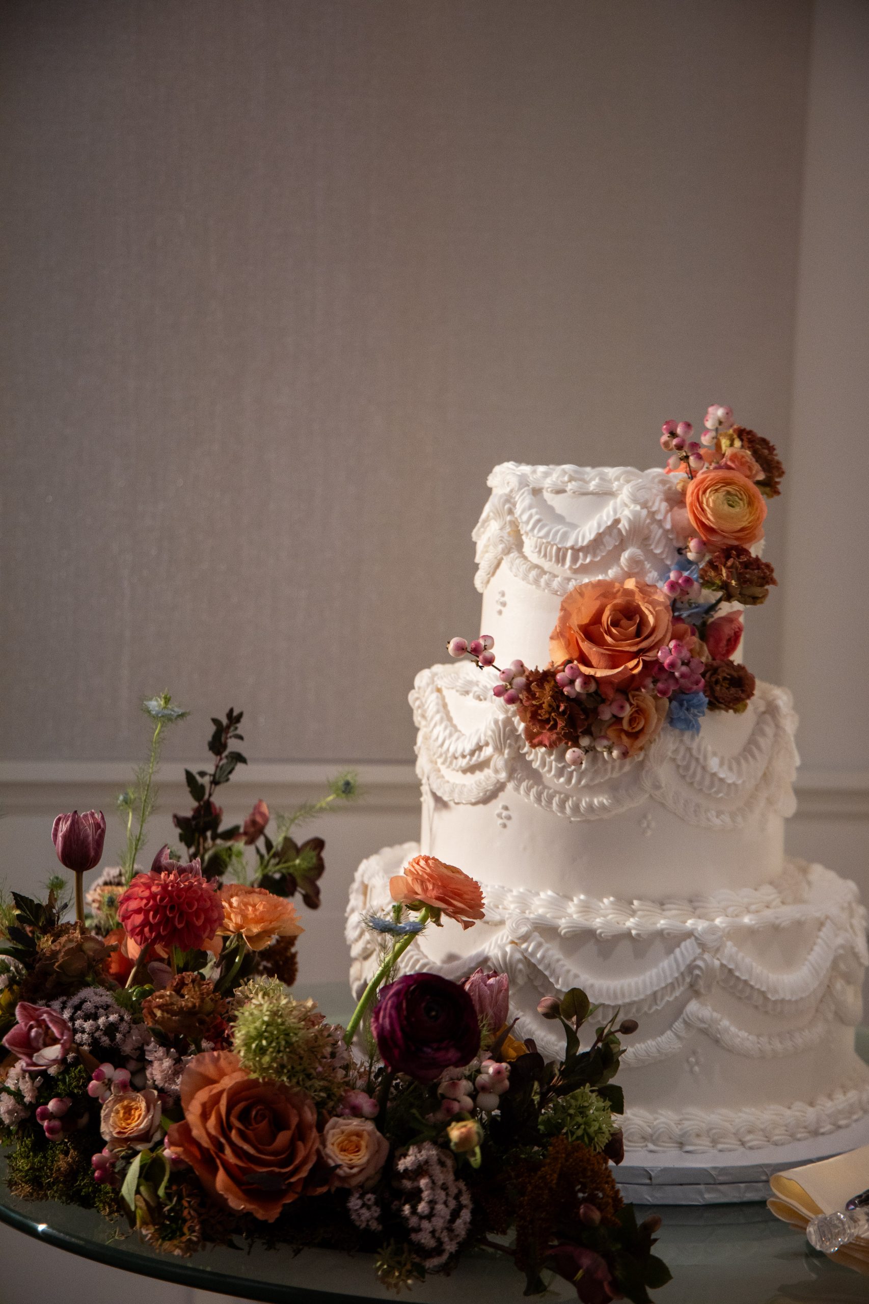 white wedding cake with colorful florals